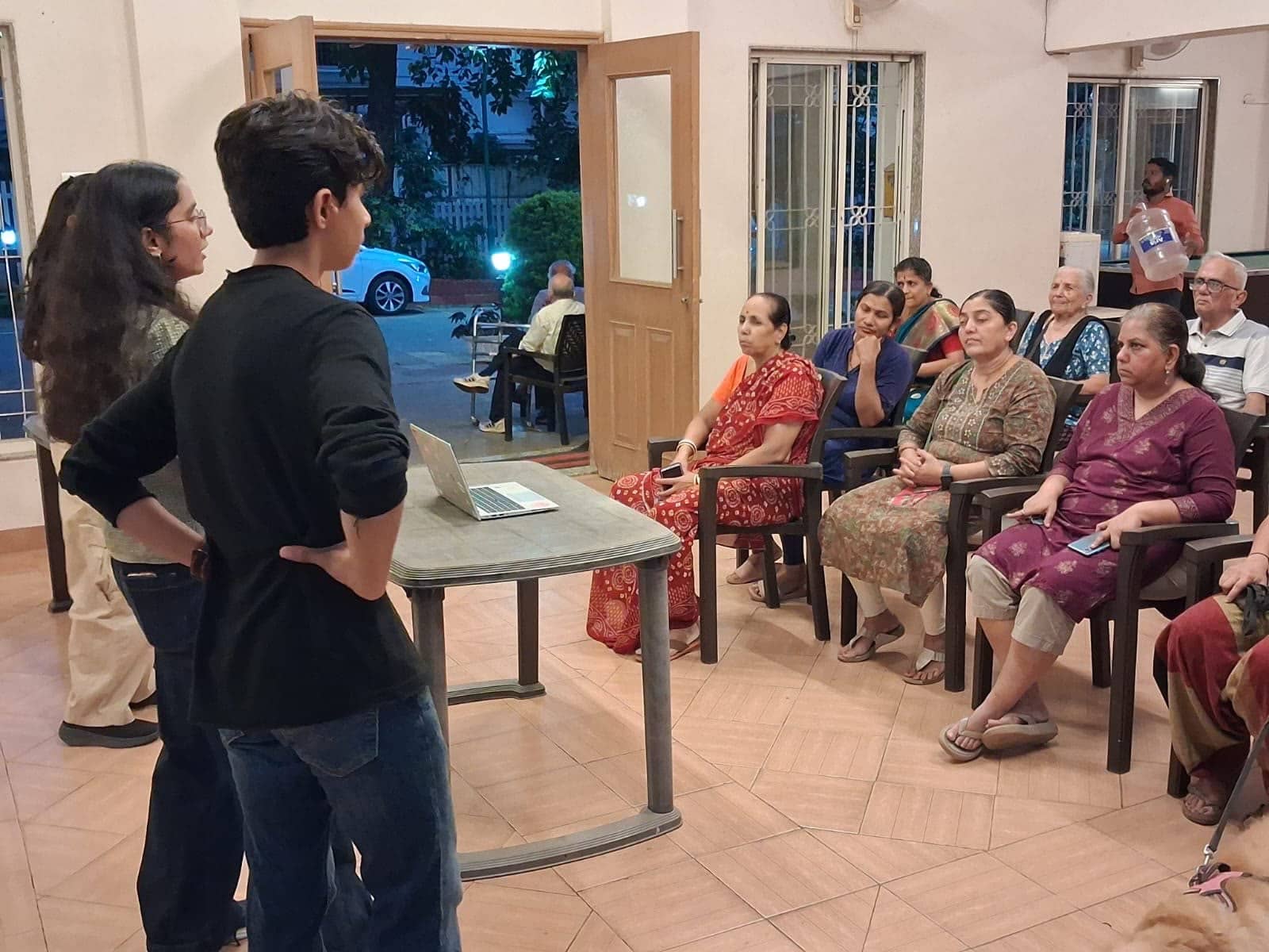 A room of seated adults at a ByteShield session, a volunteer presenting at the front.